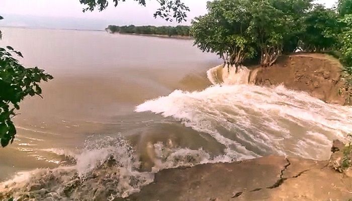 Water is entering through the Tanguar Haor dam in Tahirpur Upazila