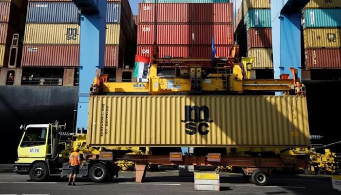 Containers carrying goods from the United Arab Emirates, which entered Israel on an MSC cargo ship, are unloaded with a cargo crane bearing Israeli and Emirati flags at Haifa's port, northern Israel October 12, 2020. || Reuters Photo: Collected  