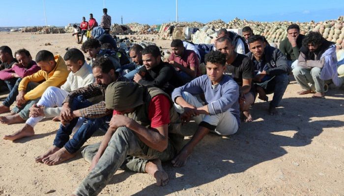 Migrants rescued by Tunisia's national guard during an attempted crossing of the Mediterranean by boat, rest in Tunisia, last December. On Saturday, Tunisian navy rescued 81 migrants who had set out for Europe from Libya. (AFP)