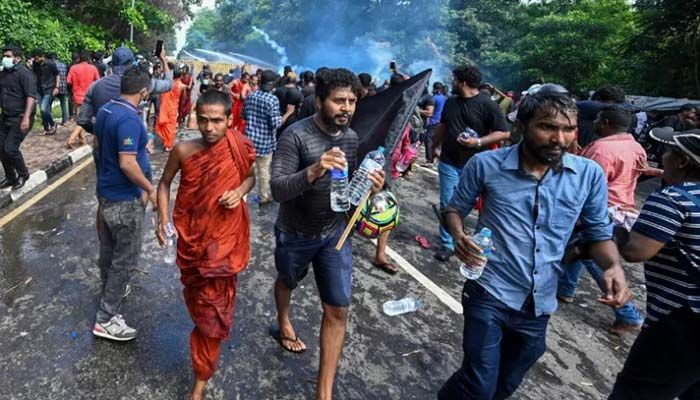Police use tear gas and a water canon to disperse university students protesting to demand the resignation of Sri Lanka's President Gotabaya Rajapaksa over the country's crippling economic crisis, near the parliament building in Colombo on May 6, 2022 || AFP Photo