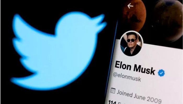 Elon Musk's twitter account is seen on a smartphone in front of the Twitter logo in this photo illustration taken, April 15, 2022 || Reuters Photo