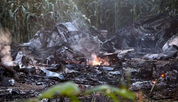 Photos taken this morning show the charred debris still aflame hours after the plane crashed || Photo: AP