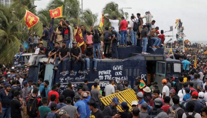 Demonstrators protest on top of a police tear gas truck after they entered the Presidential Secretariat premises, after President Gotabaya Rajapaksa fled, amid the country's economic crisis, in Colombo, Sri Lanka on July 9, 2022 || Reuters Photo
