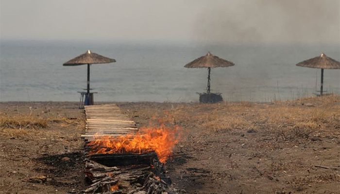 Wildfire Burns Coastal Homes in a Greek Island, Beach Resort Evacuated