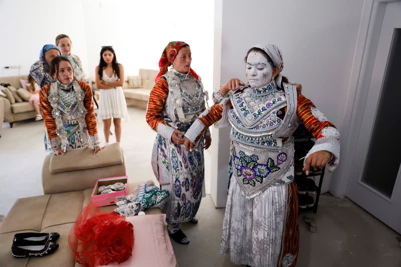 Face paint and folklore transform Chicago bride in Kosovo