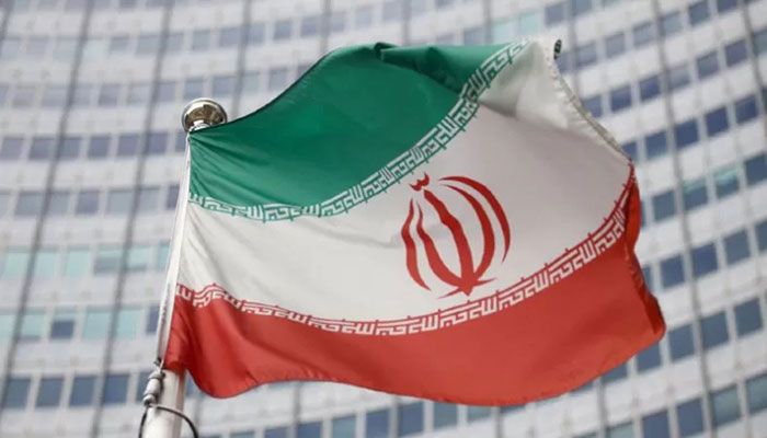 The Iranian flag waves in front of the International Atomic Energy Agency (IAEA) headquarters in Vienna, Austria, March 1, 2021. || Reuters Photo
