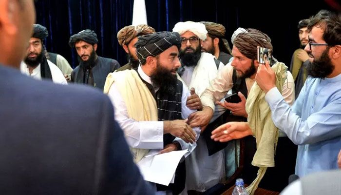 Taliban spokesperson Zabihullah Mujahid interacts after addressing the press conference || AFP File Photo