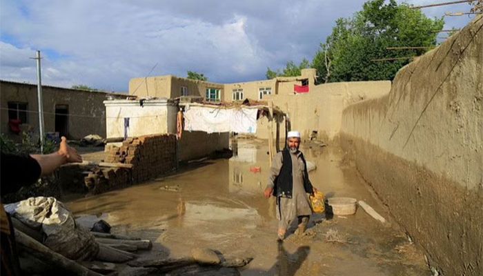 An Afghan man cleans up his damaged home after the heavy flood in the Khushi district of Logar, Afghanistan, August 21, 2022. || Reuters Photo: Collected 