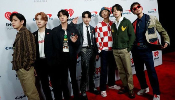 BTS poses at the carpet during arrivals ahead of iHeartRadio Jingle Ball concert at The Forum, in Inglewood, California, U.S., 3 December, 2021. || Reuters Photo: Collected   