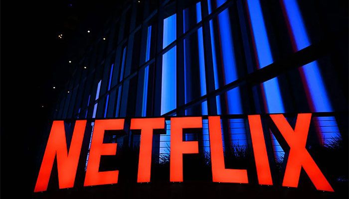 In this file photo taken on 14 September, 2022 The Netflix logo is seen at the Netflix Tudum Theater in Los Angeles, California. With the launch of cheaper, ad-supported subscriptions, Netflix and Disney+ are expected to bite into the revenue of traditional television channels as the streaming services look toward continued expansion. || Photo: AFP