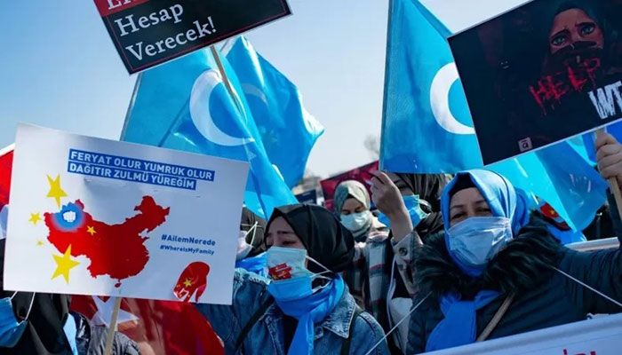 Members of the Muslim Uyghur minority demonstrate to ask for news of their relatives and to express their concern about the ratification of an extradition treaty between China and Turkey, in Istanbul on Friday || AFP Photo