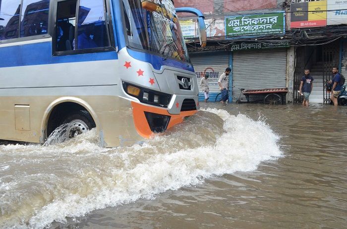 Due to the continuous heavy rain due to the impact of Cyclone Sitrang, waterlogging has occurred in various areas of Dhaka. After the stormy night, students and working people had to venture out on the flooded roads on Tuesday morning. Photo taken from Nayabazar area of the capital.