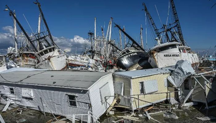 Boats and damaged houses are pictured in the aftermath of Hurricane Ian in San Carlos Island, Florida on October 1, 2022. || AFP Photo: Collected  