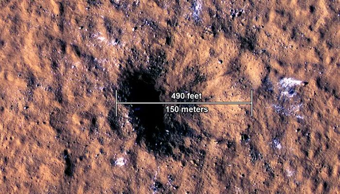 The photo taken on October 27, 2022 shows the impact crater, formed on December 24, 2021, by a meteoroid strike in the Amazonis Planitia region of Mars || Photo: Collected  