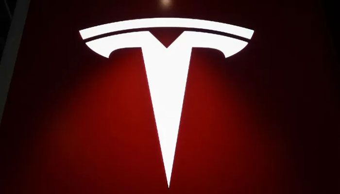 In this file photo taken on April 29, 2022 a Tesla logo is seen at a Tesla showroom at a shopping mall in Beijing. || AFP Photo
