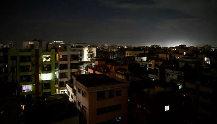 This photograph taken on October 4, 2022 shows a residential neighbourhood during a power blackout in Dhaka || AFP Photo