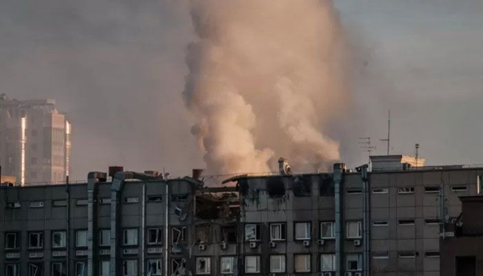 Smoke rises from a partially destroyed building in Kyiv on October 17, 2022, amid the Russian invasion of Ukraine. || AFP Photo
