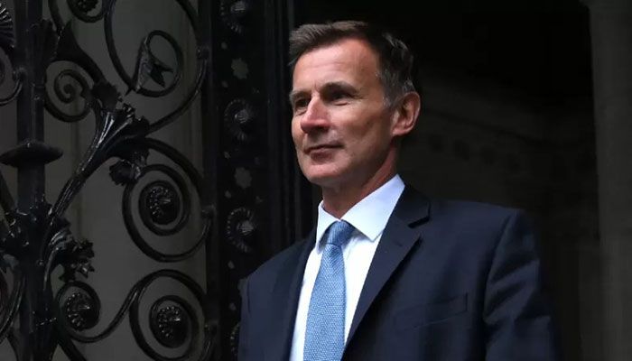 Britain's new Chancellor of the Exchequer Jeremy Hunt arrives in Downing Street in central London on October 14, 2022. || AFP Photo