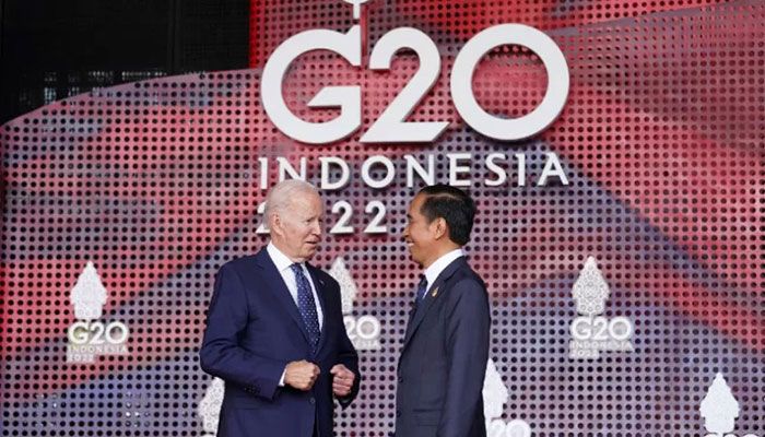 US President Joe Biden (L) talks with Indonesia's President Joko Widodo as he arrives for the G20 leaders' summit in Nusa Dua, on the Indonesian resort island of Bali on November 15, 2022. || AFP Photo