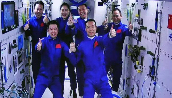 Chinese Spaceship with 3 Aboard Docks with Space Station 