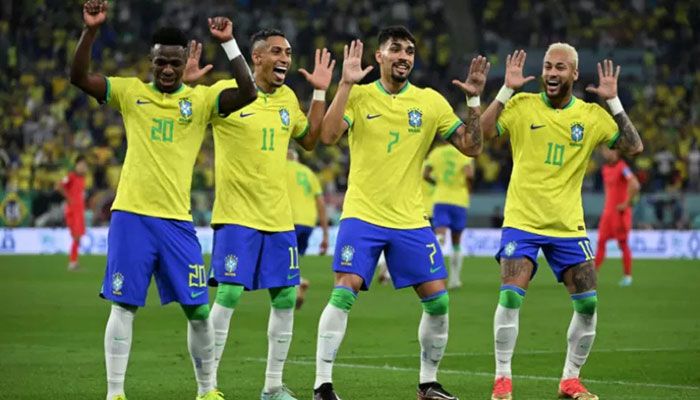 Brazil's forward Neymar celebrates with Brazil's forward Vinicius Junior, Raphinha and midfielder Lucas Paqueta after scoring his team's second goal from the penalty spot during the Qatar 2022 World Cup round of 16 football match between Brazil and South Korea at Stadium 974 in Doha on December 5, 2022 || AFP Photo