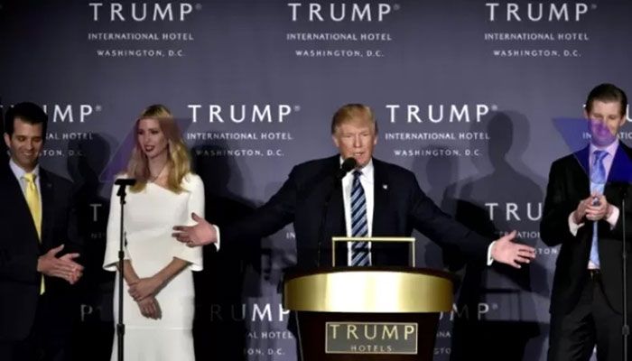 Donald Trump, with his children (L-R) Donald Junior Trump, Ivanka Trump, and Eric Trump at the opening of the Trump International Hotel in Washington, DC, on October 26, 2016 || AFP Photo