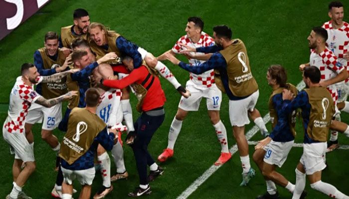 Croatia players celebrate after defeating Brazil on penalties in the Qatar 2022 World Cup quarter-final match at the Education City Stadium in Al-Rayyan, west of Doha on Friday. || AFP photo