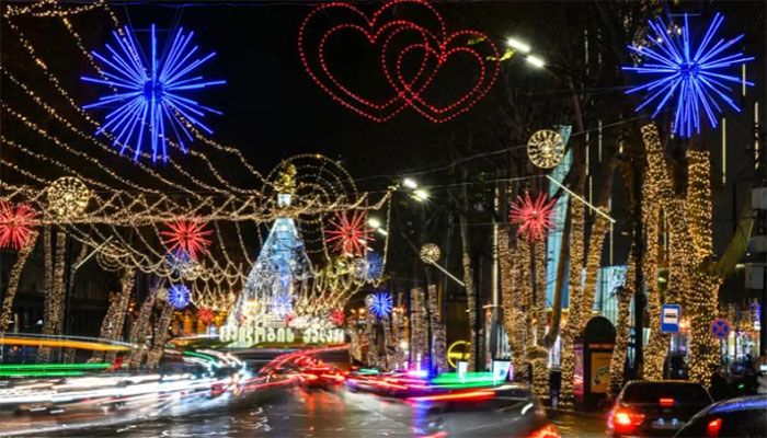 Cars drive past Christmas and New Year decorations in downtown Tbilisi, on December 20, 2022 || AFP Photo