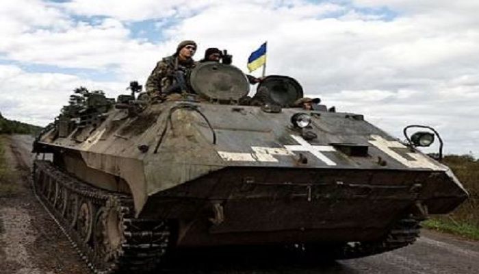 Ukrainians ride an armoured vehicle, amid Russia's attack on Ukraine, in Donesk region, Ukraine, Oct 3 2022 || Photo: REUTERS