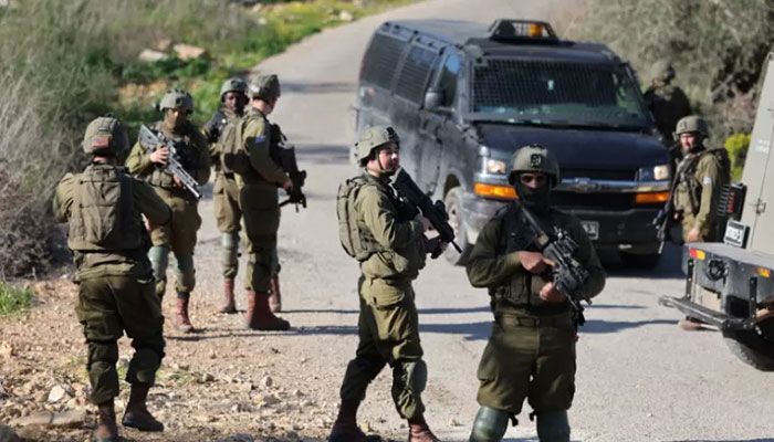 Members of Israeli security forces close-off the area of a reported stabbing attack northwest of Ramallah in the occupied West Bank, on January 21, 2023 || AFP Photo