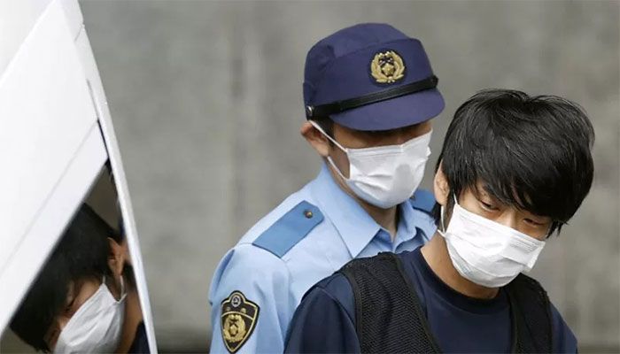 Tetsuya Yamagami, suspected of killing former Japanese Prime Minister Shinzo Abe, is escorted by a police officer as he is taken to prosecutors, at Nara-nishi police station in Nara, western Japan on July 10, 2022 || Reuters Photo