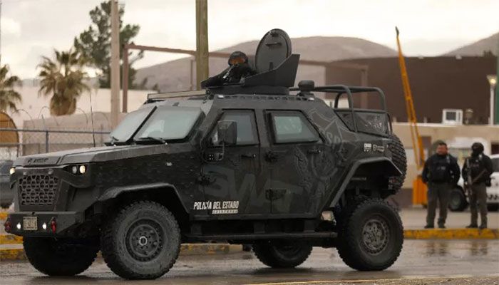 Chihuahua state police on an armoured vehicle secure an area outside Ciudad Juarez prison number 3 in Ciudad Juarez, Chihuahua state, Mexico, on January 2, 2023. || AFP Photo