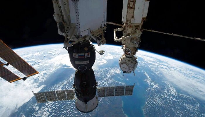 The photo provided by NASA shows the Soyuz MS-22 crew ship pictured on Oct. 8, 2002, in the foreground, docked to the Rassvet module as the International Space Station orbited 264 miles above Europe || Photo: AP