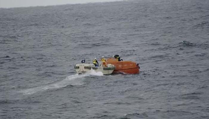 Japan Coast Guard crews check a life boat drifting at sea near the site of a cargo ship that sank off southwestern Japan in this handout image released on January 25, 2023. Courtesy of 7th Regional Coast Guard Headquarters Japan Coast Guard/Handout via REUTERS