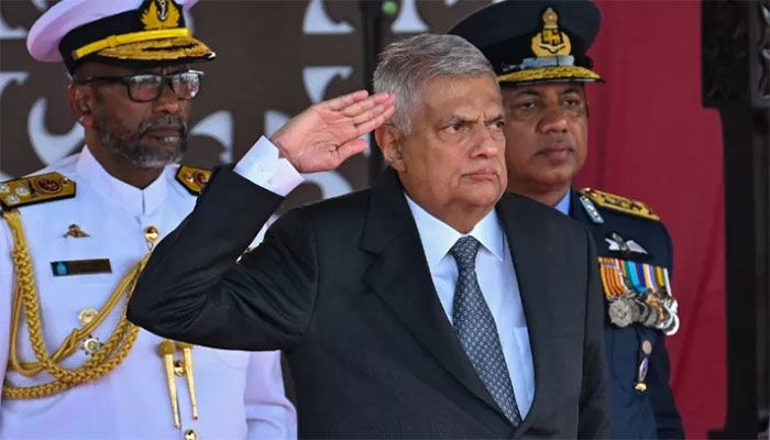 Sri Lanka's President Ranil Wickremesinghe (C) salutes during Sri Lanka's 75th Independence Day celebrations in Colombo on February 4, 2023 || AFP Photo