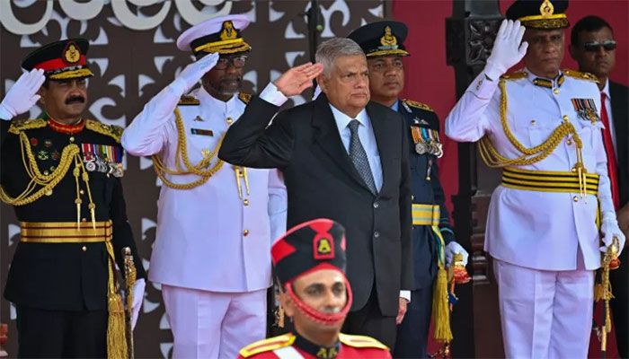 Sri Lanka's President Ranil Wickremesinghe (C) salutes during Sri Lanka's 75th Independence Day celebrations in Colombo on February 4, 2023 || AFP Photo 