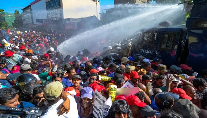 Police use water cannons and tear gas to disperse activists of the opposition National People’s Power (NPP) party during a protest held to urge the government to hold local council election as scheduled in Colombo on February 26, 2023 || AFP Photo