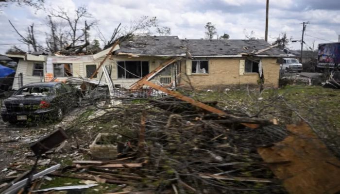 A storm damaged home is seen from US President Joe Bidens motorcade as they drive through the storm-stricken area of Rolling Fork, Mississippi, on March 31, 2023 || AFP Photo