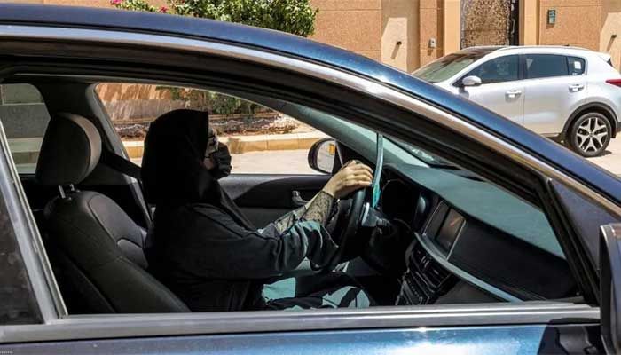 A woman drives a vehicle along a street in Riyadh on July 5, 2023 || AFP photo