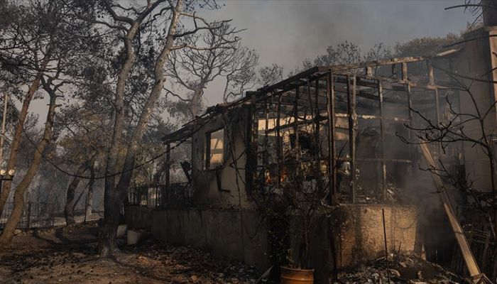 A house is destroyed in a wildfire in Agia Sotira, a western suburb of Athens, Greece, on July 20, 2023. For the fourth consecutive day, the wildfires continue to ravage houses and forests in the western part of Athens.