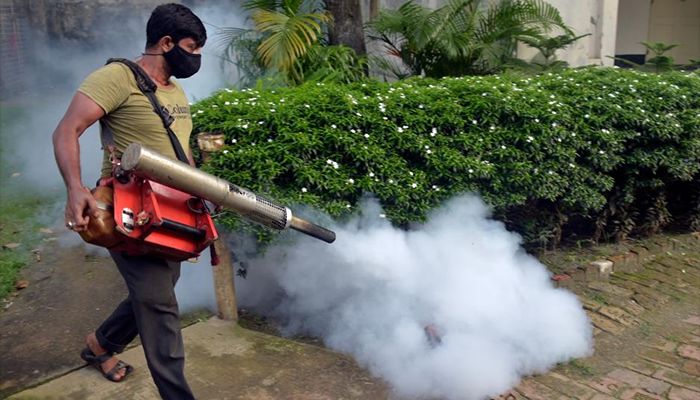 In an effort to halt the dengue virus from spreading throughout Dhaka, a worker sprays anti-mosquito fog.