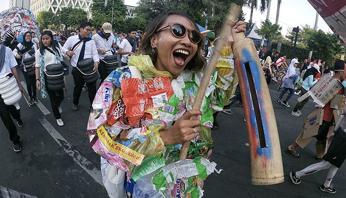A protester marches at the Plastic Free Parade in Jakarta.