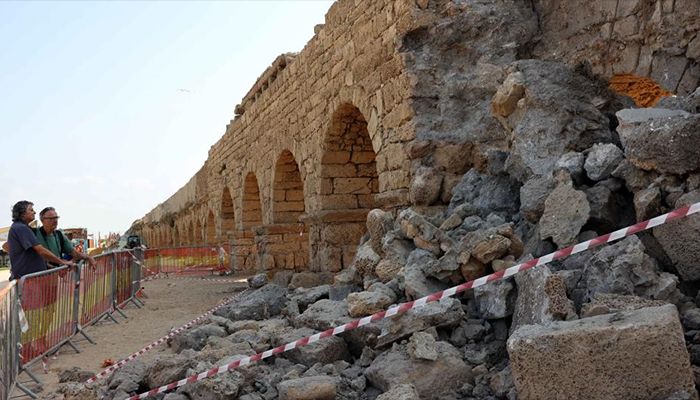 This picture shows the collapsed arch of the Roman aqueduct system on a beach in Caesarea, Israel. An ancient arch structure in Caesarea's famous ancient Roman aqueduct system collapsed on a beach early Friday morning. Israel Antiquities Authority said the section that collapsed was built in the time of Emperor Hadrian, some 1900 years ago.