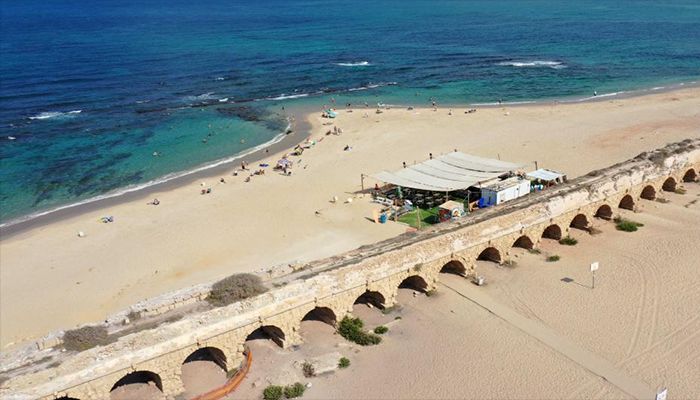 This aerial photo shows a view of the Roman aqueduct system on a beach in Caesarea, Israel. An ancient arch structure in Caesarea's famous ancient Roman aqueduct system collapsed on a beach early Friday morning. Israel Antiquities Authority said the section that collapsed was built in the time of Emperor Hadrian, some 1900 years ago.