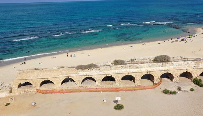 The Roman aqueduct system on a beach in Caesarea, Israel. An ancient arch structure in Caesarea's famous ancient Roman aqueduct system collapsed on a beach early Friday morning. Israel Antiquities Authority said the section that collapsed was built in the time of Emperor Hadrian, some 1900 years ago.