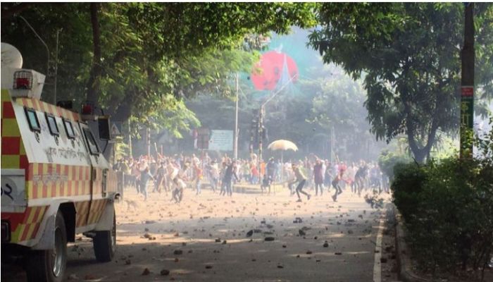 Bangladesh Nationalist Party activists throw brick bats targeting police who lob teargas shells and charge baton to the opposition activists at Kakrail in Dhaka. Focusbangla Photo.