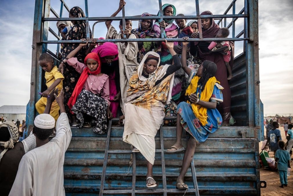 Renk, South Sudan: Sudanese refugees who have fled from the war disembark from a truck loaded with families arriving at a transit centre for refugees in Renk. More than 550,000 people have now fled from the war in Sudan to South Sudan since April 2023, according to the UN || Photo: AFP