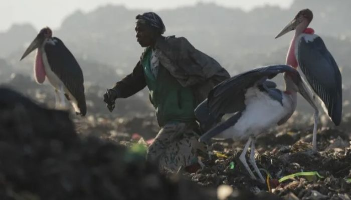 A Woman Who Scavenges Recyclable Materials From Garbage Dump In The Capital Nairobi, Kenya On March 20, 2024. Photo: AP 
