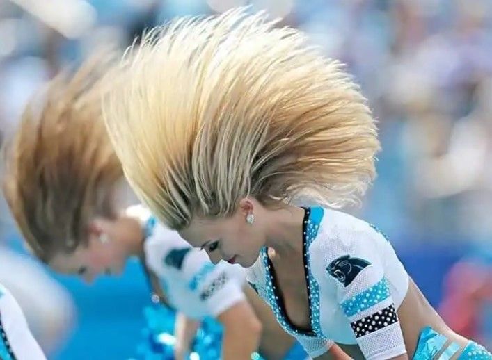 This is on full display in a 2016 photo of the Carolina Panthers cheerleaders, whose ensemble, which sets new standards in creativity and style, is more reminiscent of a peacock panorama than the classic image of a football sideline. It captures the electricity, charisma and coordinated dance of the cheerleaders in one enchanting moment