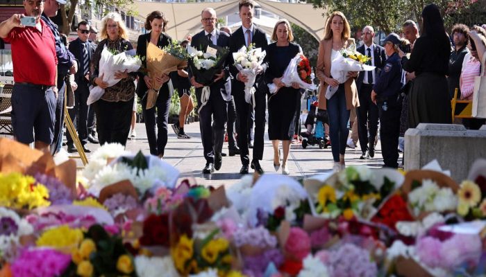 Australian Prime Minister Anthony Albanese (C) Walks With New South Wales Premier Chris Minns (Centre R) And Other Officials To Leave Flowers Outside The Westfield Bondi Junction Shopping Mall In Sydney On April 14, 2024. Photo: AFP